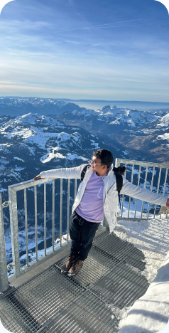 Overlooking snowy mountains from a viewpoint balcony